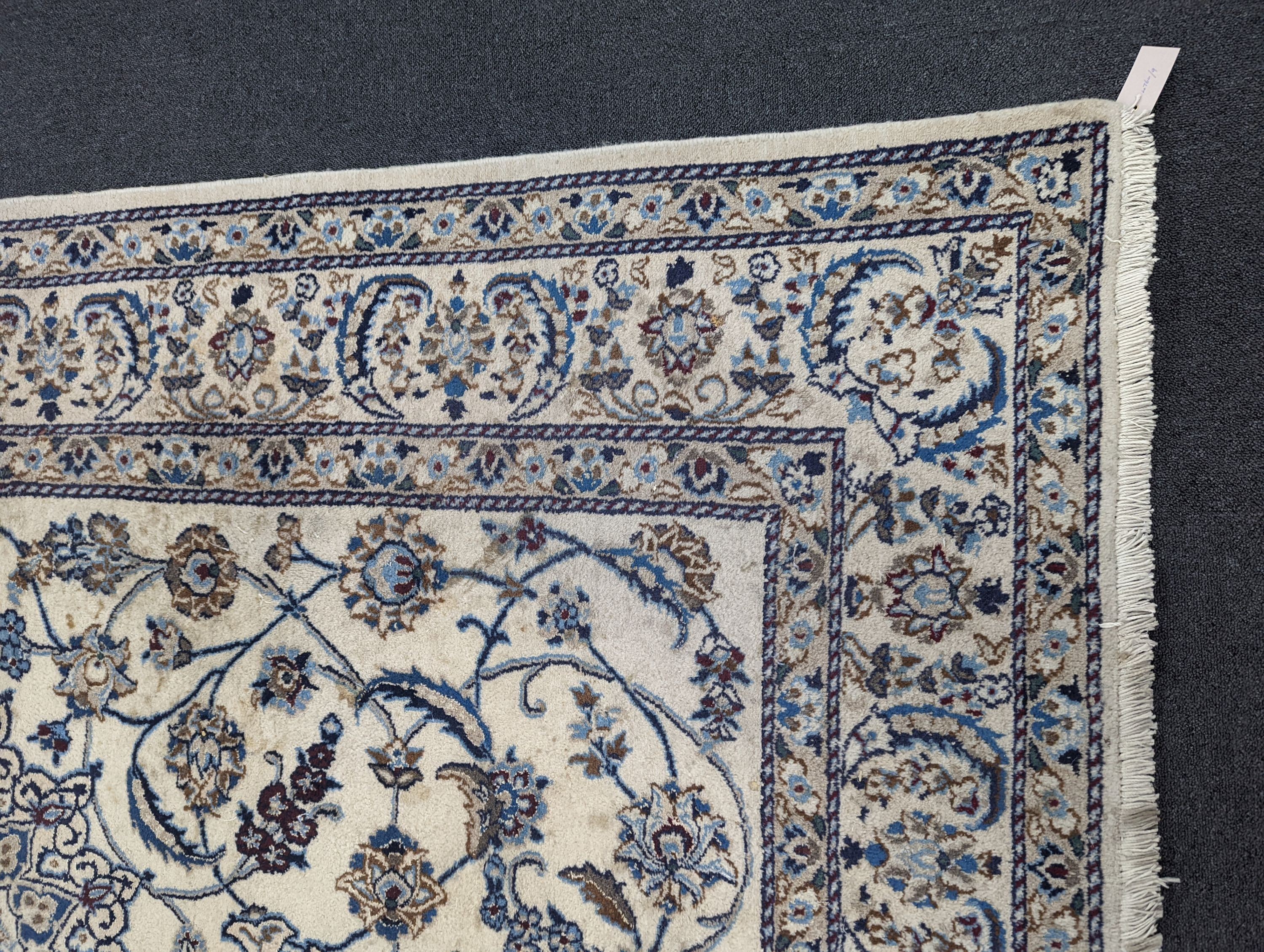 An ivory ground Nain carpet, 290 x 205cm